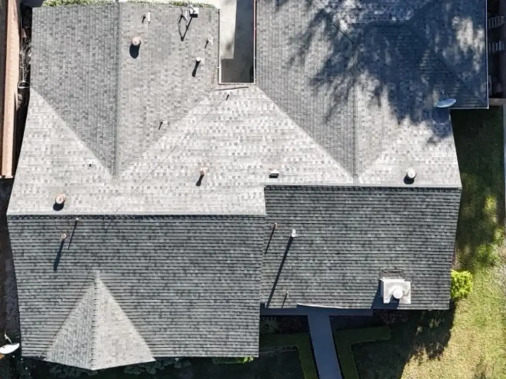 Before: worn shingle roof