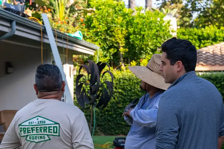 Preferred Roofing estimator walking a homeowner through their roof